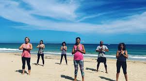 Yoga Class on the Beach by Santosa